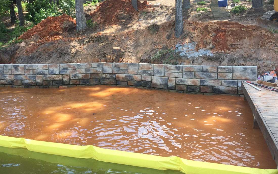 Retaining wall crew working on lake wall at Lake Arrowhead