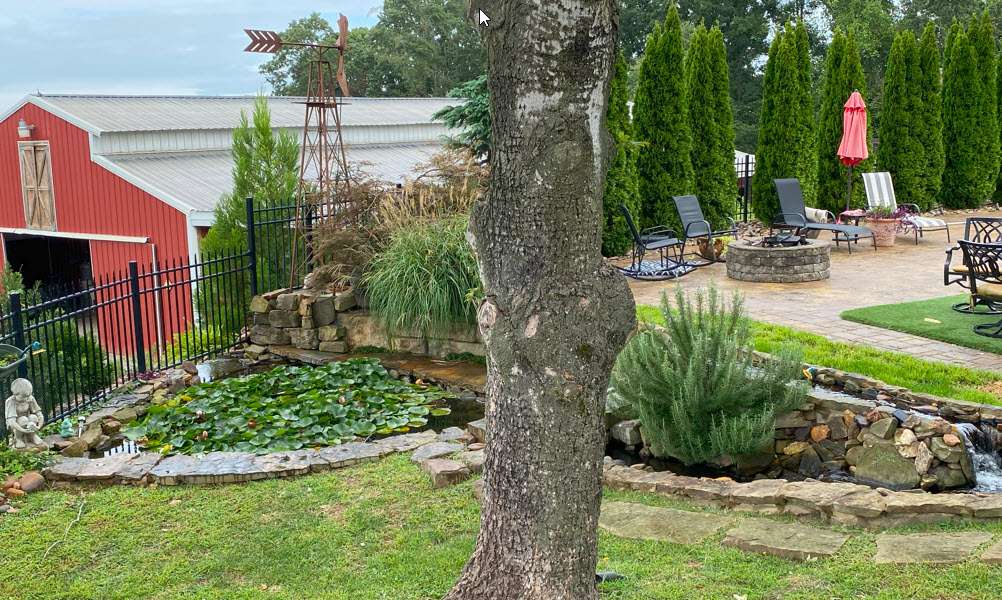 Water feature and fish pond by Sugar Hill swimming pool area
